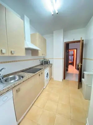 a kitchen with a sink and a counter top at Piso en el Centro de Sanlucar in Sanlúcar de Barrameda