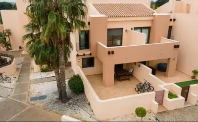 an aerial view of a house with a palm tree at New Golf Villa and Pool - Families Only in Barrio de Jarana