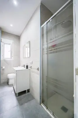 a bathroom with a shower and a toilet and a sink at Apartamento Plaza Falla Caleta in Cádiz