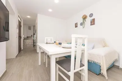 a white desk in a room with a bed at El Mirador de Arcos in Arcos de la Frontera