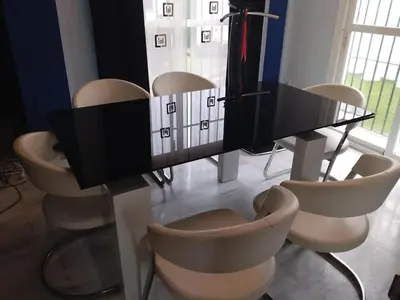 a dining room table with chairs and a piano at En el centro de todo in Puerto Real
