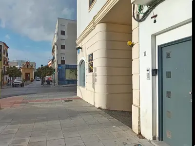 a building with a door on the side of a street at Puerta del Sol Jerez in Jerez de la Frontera