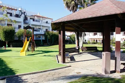 a park with a playground with a slide at Ático, El Refugio de Sancti Petri in Novo Sancti Petri