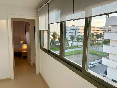 a room with a window with a view of a street at GATU Atikus in El Puerto de Santa María
