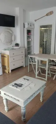 a living room with a white table and a desk at Loft El pez blanco in El Puerto de Santa María