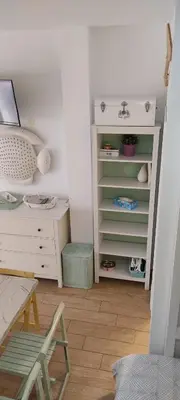 a room with a desk and a table with a chair at Loft El pez blanco in El Puerto de Santa María