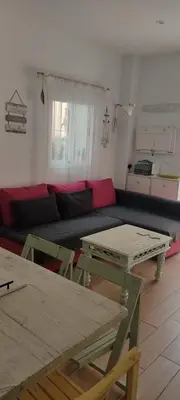 a living room with a couch and tables at Loft El pez blanco in El Puerto de Santa María