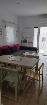 a living room with a table and a couch at Loft El pez blanco in El Puerto de Santa María