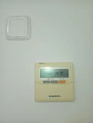a clock on a white wall with a white wall at Tartaneros Playa con Parking in Sanlúcar de Barrameda