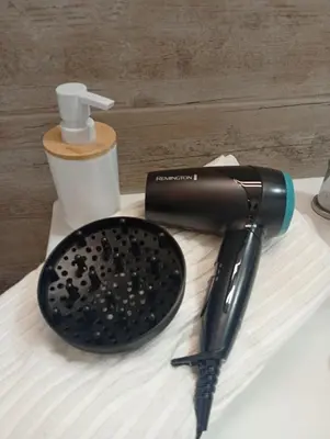 a hair dryer sitting on top of a table at Tartaneros Playa con Parking in Sanlúcar de Barrameda