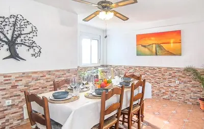 a dining room with a table and chairs at Stunning Home In Chiclana De La Fronter in Novo Sancti Petri