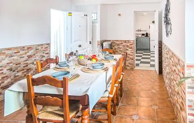 a dining room with a table and chairs at Stunning Home In Chiclana De La Fronter in Novo Sancti Petri