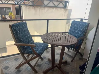 two chairs and a table on a balcony at Apartamento Sanlúcar in Sanlúcar de Barrameda