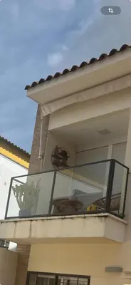 a balcony with a table and chairs on it at Apartamento Sanlúcar in Sanlúcar de Barrameda