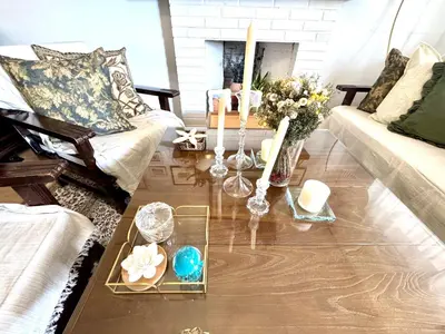 a living room with a couch and a table with candles at a casiña cottage in Chiclana in Chiclana de la Frontera