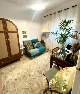 a living room with a couch and a table at a casiña cottage in Chiclana in Chiclana de la Frontera