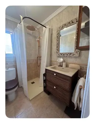 a bathroom with a sink and a shower and a toilet at a casiña cottage in Chiclana in Chiclana de la Frontera