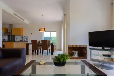 a living room with a tv and a dining room at Villa 237 by Villamya in Arcos de la Frontera