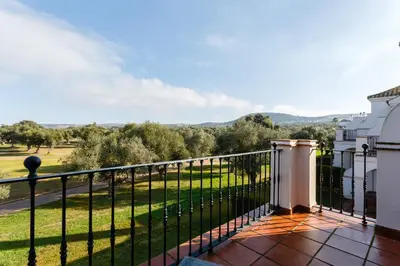 a balcony with a view of a green field at Villa 237 by Villamya in Arcos de la Frontera