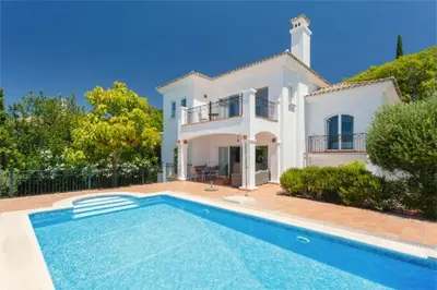a villa with a swimming pool in front of a house at Villa 235 by Villamya in Arcos de la Frontera