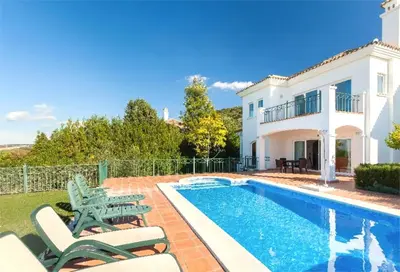 a villa with a swimming pool and a house at Villa 235 by Villamya in Arcos de la Frontera
