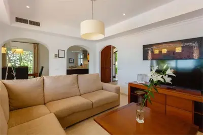 a living room with a couch and a tv at Villa 235 by Villamya in Arcos de la Frontera