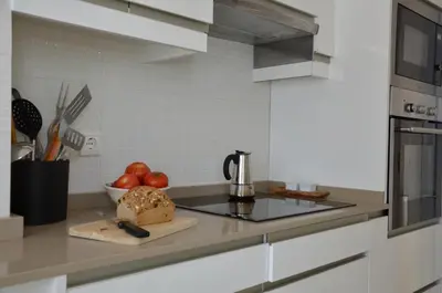 a kitchen with a counter top with a sink at Villa Puntalejo por Living Cadiz in Conil de la Frontera
