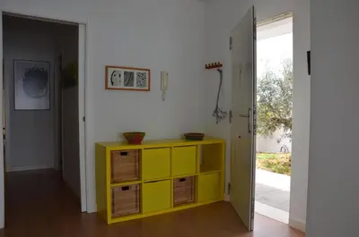 a yellow dresser in a room with a doorway at Villa Puntalejo por Living Cadiz in Conil de la Frontera