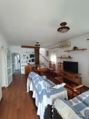 a living room with two couches and a table at Beachside Duplex Chalet -800 m to La Barrosa Beach in Novo Sancti Petri