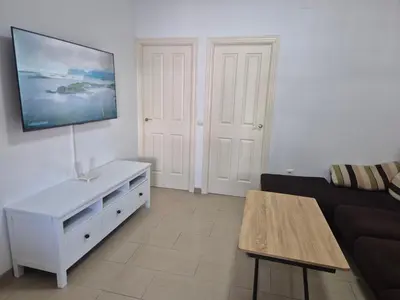 a kitchen with white cabinets and a counter top at Apartamento Bahia de Cadiz in Puerto Real