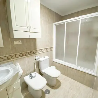 a bathroom with a white toilet and a sink at Bulerías de Cádiz by Gades Gestión in Cádiz