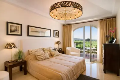 a bedroom with a bed and a large window at Villa 231 by Villamya in Arcos de la Frontera