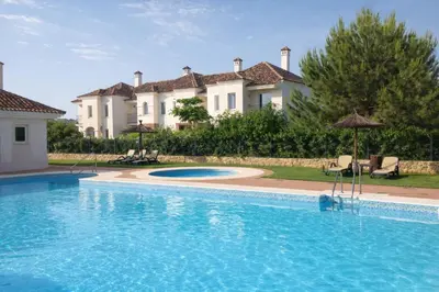 a large swimming pool in front of a large house at Villa 231 by Villamya in Arcos de la Frontera