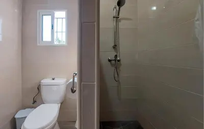 a bathroom with a toilet and a shower at Awesome Home In San José Del Valle in San Jose del Valle