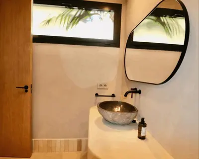 a flat screen tv sitting on top of a wooden stand at Villa Colorado Roche - a unos minutos de la playa in Roche