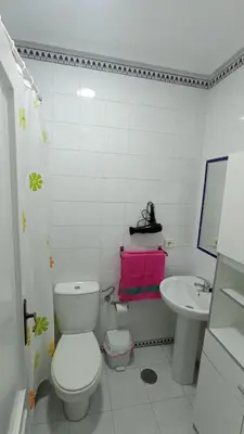 a bathroom with a toilet and a sink at Apartamento en La Barrosa, Chiclana de la Frontera in Novo Sancti Petri