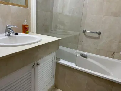 a bathroom with a sink and a shower and a tub at Paseo Marítimo 8 Cádiz in Cádiz