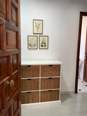 a dresser in a room with two pictures on the wall at Paseo Marítimo 8 Cádiz in Cádiz