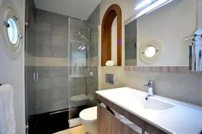 a bathroom with a sink and a shower and a toilet at El Armador Casa Palacio by Luxury Suites Cádiz in Cádiz