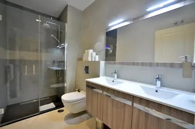 a bathroom with a sink and a toilet and a shower at El Armador Casa Palacio by Luxury Suites Cádiz in Cádiz