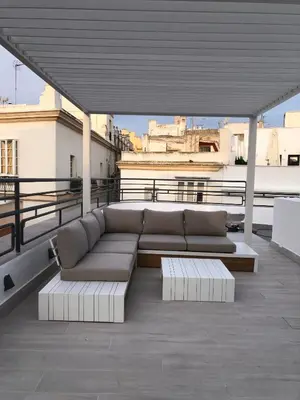 a couch sitting on top of a roof at Apartamentos GADIR CENTRO in Cádiz