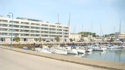 a bunch of boats are docked in a marina at Apartamento Medina Puerto Sherry in El Puerto de Santa María