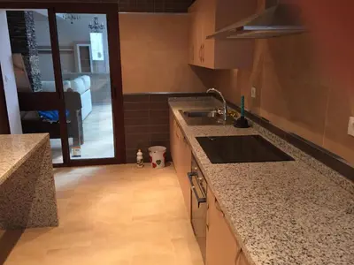 a kitchen with a sink and a counter top at Cadiz Deluxe Apartment in Cádiz