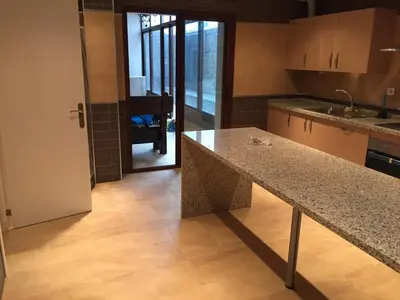 a kitchen with a granite counter top in a room at Cadiz Deluxe Apartment in Cádiz