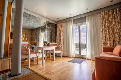 a dining room with a table and chairs at Hotel Balneario de Chiclana in Chiclana de la Frontera