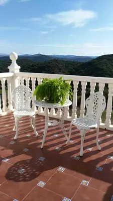 a table and two chairs on a balcony with a view at Elegant Villa in Algar with Private Pool in Algar