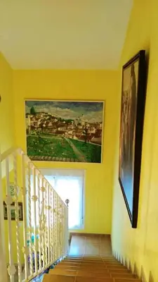 a hallway with a painting on the wall and a staircase at Elegant Villa in Algar with Private Pool in Algar
