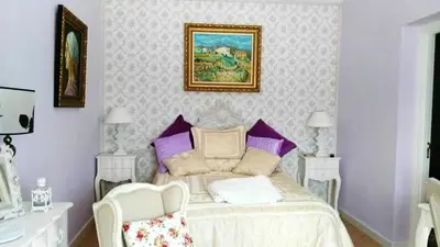 a bedroom with a bed and a picture on the wall at Elegant Villa in Algar with Private Pool in Algar