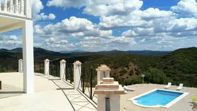 a house with a swimming pool on a balcony at Elegant Villa in Algar with Private Pool in Algar