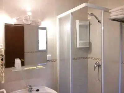 a bathroom with a shower and a sink at Casa Inocencio in El Puerto de Santa María